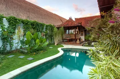 a swimming pool in front of a house at Villa Chantal-Intimate Villa in Seminyak in Seminyak