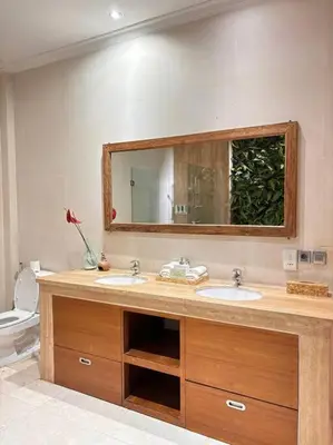 a bathroom with two sinks and a mirror at 4 Bedroom Tropical Luxury Villa in Seminyak