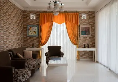 a living room with a couch and a large window at Villa with view rooftop in Nusa Dua Bukit in Nusa Dua