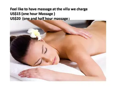 a woman is laying on a towel in a spa at Sol Bella Villa 3 in Seminyak
