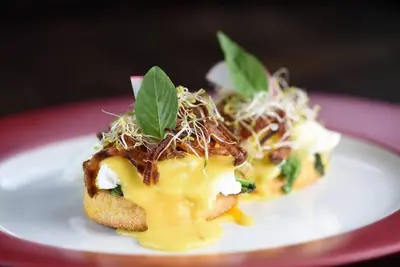 two pieces of food on a white plate at Sol Bella Villa 3 in Seminyak