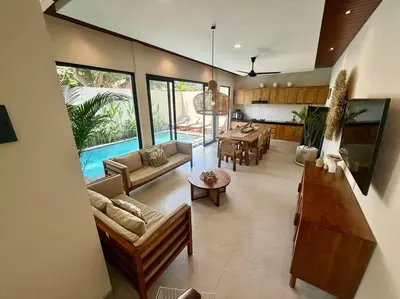 a living room with a couch and a table at Villa NANEE - Legian - 5 Bedroom - 5 Bathroom in Legian