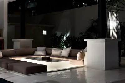 a living room with a couch and a table at Villa Malicott Athena - 3C in Seminyak