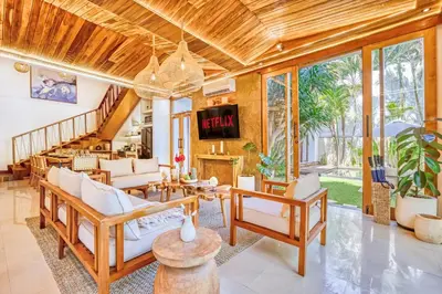 a living room filled with furniture and a chandelier at Villa Chicago Brand new 7 BDR private pool in Seminyak
