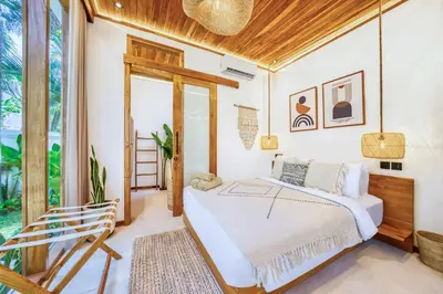 a bedroom with a bed and a balcony at Villa Chicago Brand new 7 BDR private pool in Seminyak