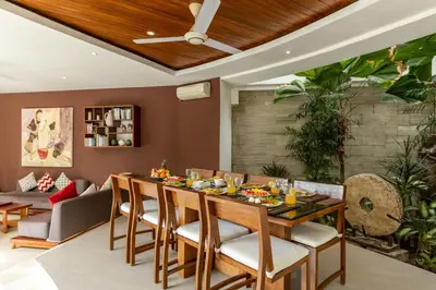 a dining room with a table and chairs at Spacious 4BR Villa with Pool in Central Seminyak in Seminyak