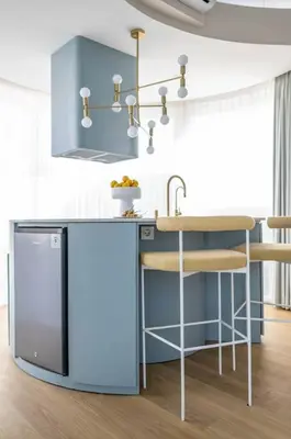 a kitchen with a blue island with a sink at Uniquely designed 1bd villa with Pvt Pool in Umalas
