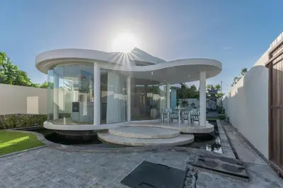 a large house with a circular roof at Uniquely designed 1bd villa with Pvt Pool in Umalas