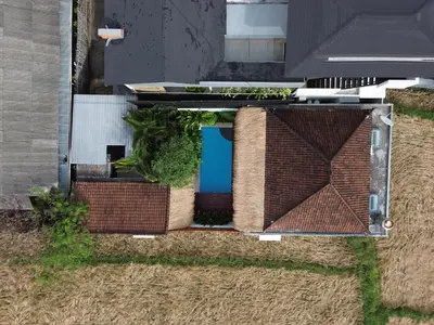an overhead view of a house with a pool on the roof at Bubble Villa & Rice field view in Kerobokan
