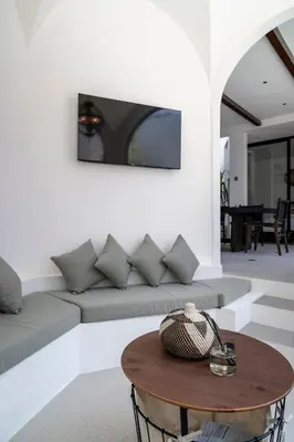 a living room with a couch and a table at Villa Adela 1 Berawa 3BR Villa Near Atlas, Finns Beach Clubs in Canggu