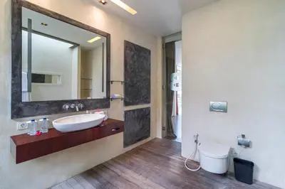 a bathroom with a sink and a mirror at Stunning 4 Bed, Butler Service, Security, Central in Seminyak