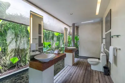 a bathroom with two sinks and two toilets at Stunning 4 Bed, Butler Service, Security, Central in Seminyak