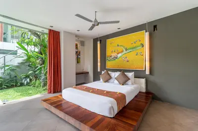 a bedroom with a large bed and a large window at Stunning 4 Bed, Butler Service, Security, Central in Seminyak
