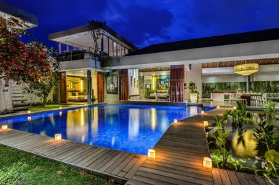 a swimming pool in the backyard of a house at Stunning 4 Bed, Butler Service, Security, Central in Seminyak