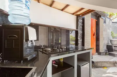 a kitchen with a counter top with a microwave at Sunset view apartment in Nusa Dua in Nusa Dua