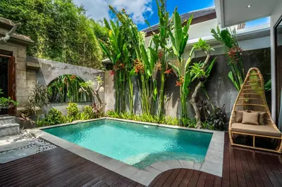 a swimming pool in the backyard of a house at Villa Liamax by JB villas in Seminyak