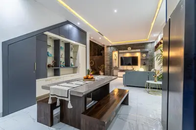 a kitchen with a counter top and a table at Villa Ashëla by JB Villas in Seminyak