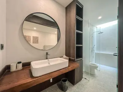 a bathroom with a sink and a mirror at Cara Villa Bali in Seminyak