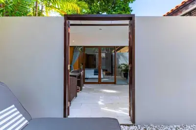 an open door of a house with a patio at Omkara 2 BR Deluxe Private Pool Villa ZN253 in Seminyak