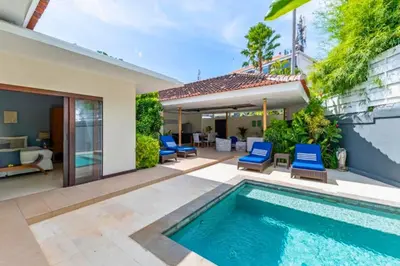 a villa with a swimming pool and a patio at Omkara 2 BR Deluxe Private Pool Villa ZN253 in Seminyak