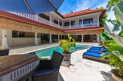 an exterior view of a house with a swimming pool at Onkita 4 BR Private Pool Villa ZN254 in Seminyak