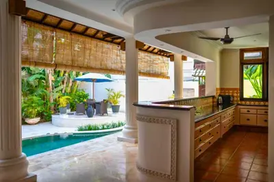 a kitchen with a swimming pool in a house at Onkita 4 BR Private Pool Villa ZN254 in Seminyak