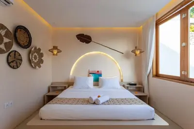 a bedroom with a bed with a stuffed animal on it at Villa Umi Paradise Bliss 3BD Villa in Prime Area in Umalas