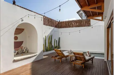 a patio with two chairs and a table at Villa Umi Paradise Bliss 3BD Villa in Prime Area in Umalas