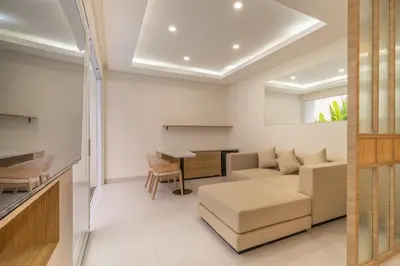 a living room with a couch and a table at Arunika Prime Villa in Seminyak