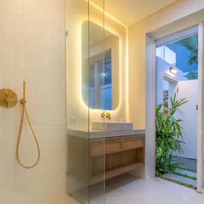 a bathroom with a sink and a mirror at Arunika Prime Villa in Seminyak