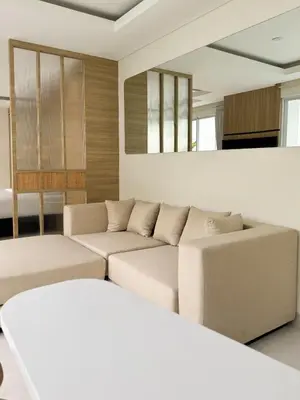 a living room with a couch and a table at Arunika Prime Villa in Seminyak