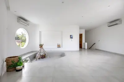 a white room with a tub and a window at Villa Harper by BaliSuperHost in Canggu