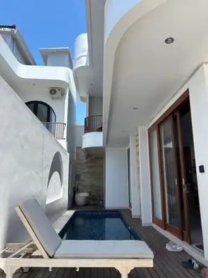 a swimming pool in the middle of a house at Villa with pool Nusa Dua in Nusa Dua