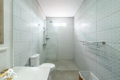 a bathroom with a shower and a toilet and a sink at Villa Sila by Bukit Vista in Canggu