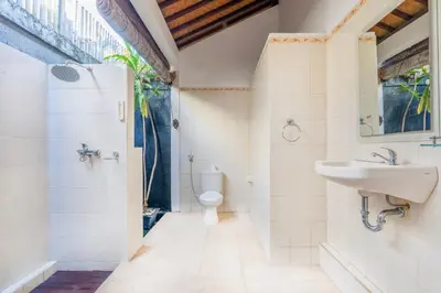 a bathroom with a sink and a toilet at Villa Jasmin Seminyak in Seminyak