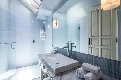 a white bathroom with a sink and a mirror at 2 BedRoom Villa Hideaways Seminyak in Seminyak