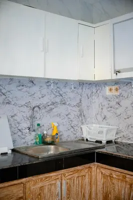 a kitchen with a sink and a counter top at Lily Villa in Seminyak