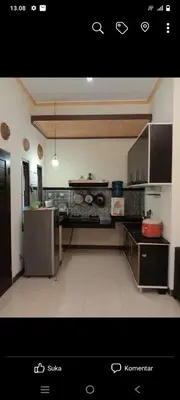 a kitchen with stainless steel appliances in a room at Nyoman bali house villa in Seminyak