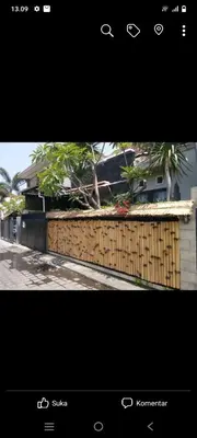a picture of a fence with a house at Nyoman bali house villa in Seminyak