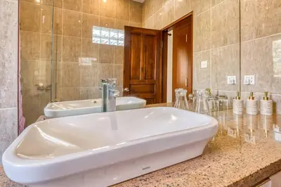 a large bathroom with two sinks and a tub at Villa Ima in Canggu