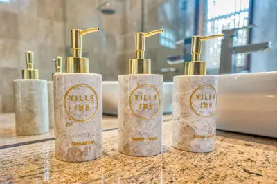 a group of three soap dispensers sitting on a counter at Villa Ima in Canggu