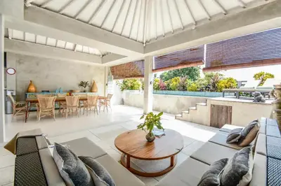 a living room with a couch and a table at DUUR Apartments in Seminyak