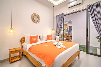 a bedroom with a bed with a stuffed animal on it at Villa Esha III in Seminyak