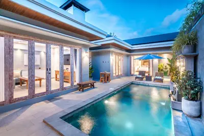 an image of a swimming pool in a house at Villa Indah in Legian