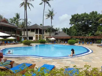 a woman is in the pool at a resort at Private Apartment 6503 at the Jayakarta Residence in Seminyak