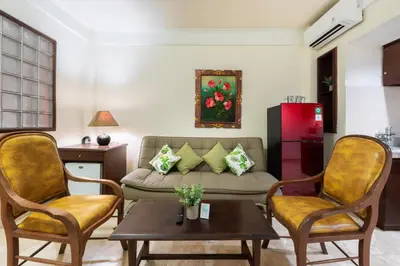 a living room with a couch and two chairs at Private Apartment 6503 at the Jayakarta Residence in Seminyak