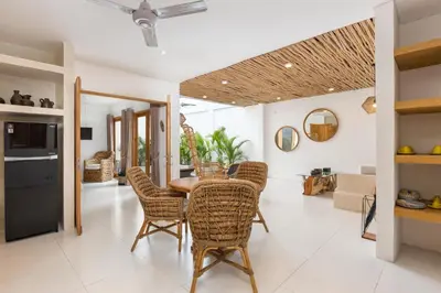 a kitchen and dining room with a table and chairs at Spacious 1Br Villas in Seminyak in Seminyak