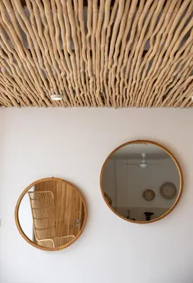 a mirror on a wall with a wicker ceiling at Spacious 1Br Villas in Seminyak in Seminyak