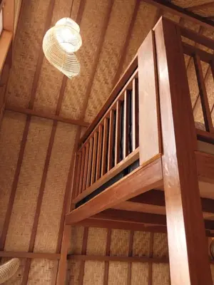 a wooden staircase in a room with a ceiling at Thula Thula Bali Villas in Kerobokan