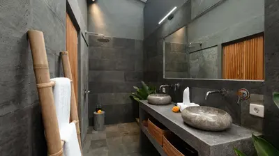 a bathroom with a sink and a mirror at Alarte Estate by Villa Finder in Seminyak